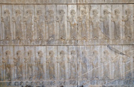 Photo for Ancient wall with bas-relief with assyrian warriors with spears, Persepolis, Iran. UNESCO world heritage site - Royalty Free Image