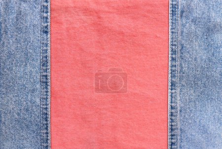 Photo for Blue denim borders with a seam and coral cotton texture. Light blue and pink color denim jeans fabric. Copy space for text - Royalty Free Image