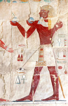 Photo for Ancient Colorful Mural Wall Painting inside Hatshepsut Temple in Valley of the Kings, Luxor, Egypt. Figure of the pharaoh making ritual offerings, wall of the Hatshepsut temple in Western Thebes - Royalty Free Image