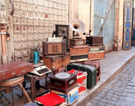 Photo for Vintage and antique objects - gramophone, typewriter, telephone, at the flea market on Khan Al-Khalili Bazaar, Cairo, Egypt - Royalty Free Image