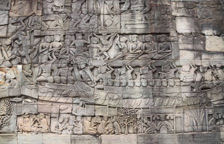 Foto de Talla mural del templo de Prasat Bayon en el famoso complejo Angkor Wat, Siem Reap, Camboya. Bajorrelieve que representa a los campesinos en su rutina diaria - Imagen libre de derechos