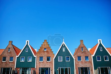 Photo for Colorful houses in marine park in Volendam. Typical Dutch landscape in North Holland, the Netherlands. - Royalty Free Image