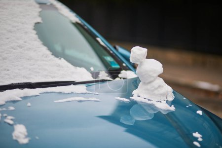 Photo for Car covered with little funny snowman. Snowy day in Paris, France - Royalty Free Image
