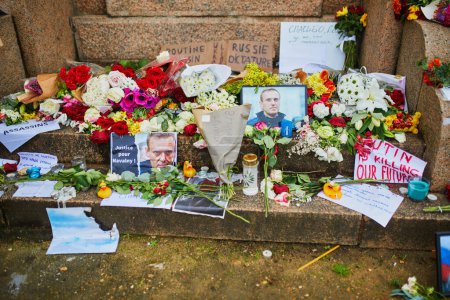 Photo for PARIS, FRANCE - FEBRUARY 19, 2024: Temporary memorial for Alexei Navalny near Peter of Serbia first monument and not far from the Russian embassy in Paris, France - Royalty Free Image