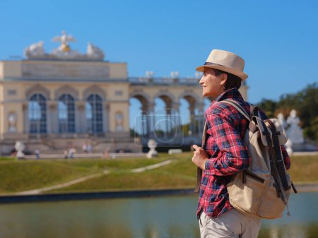 Photo for Summer female solo trip to Europe, happy young woman walking , Schonbrunn Palace in Vienna, Austria - Royalty Free Image