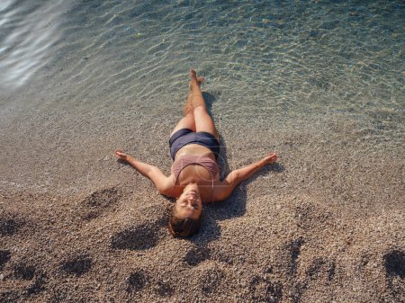 Photo for Cheerful woman enjoying the beach Oludeniz Blue Lagoon Turkey. Life of people xl size, happy nice natural beauty woman - Royalty Free Image