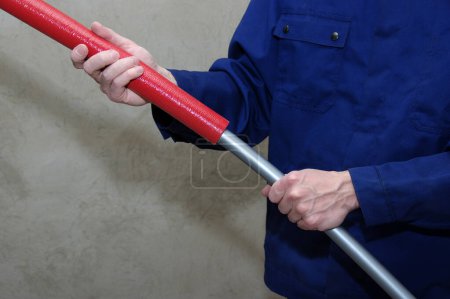Photo for Plumber installing plastic pipes, doing maintenance jobs for water and heating systems. - Royalty Free Image