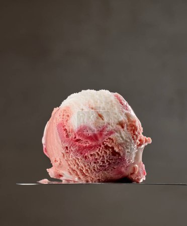 Photo for Vanilla and strawberry ice cream ball on grey background - Royalty Free Image
