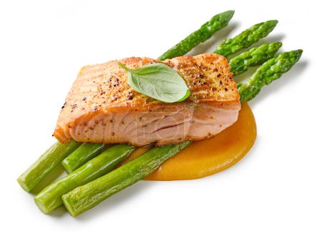 Téléchargez les photos : Fried spicy salmon steak and asparagus isolated on white background - en image libre de droit