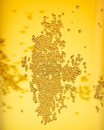 Photo for Close up background texture of lager beer with bubbles - Royalty Free Image