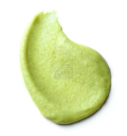 Foto de Green vegetable puree isolated on white background, top view - Imagen libre de derechos
