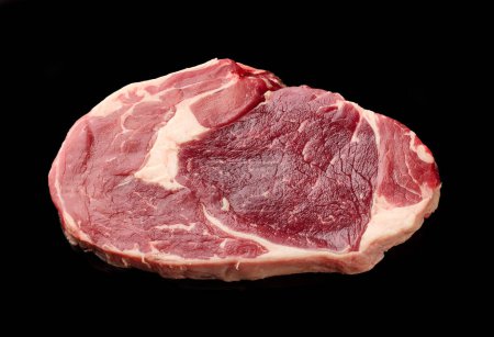 Photo for Fresh raw beef entrecote steak isolated on black background, top view - Royalty Free Image