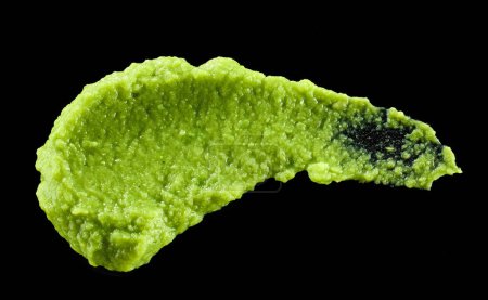 Photo for Green vegetable puree isolated on black background, top view - Royalty Free Image