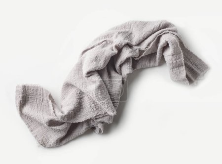 Foto de Servilleta de algodón arrugado gris sobre fondo blanco, vista superior - Imagen libre de derechos