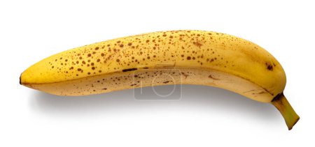 Téléchargez les photos : Banane jaune très mûre avec des taches brunes isolées sur fond blanc, vue de dessus - en image libre de droit