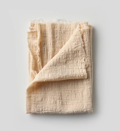 Foto de Servilleta de algodón plegada aislada sobre fondo blanco, vista superior - Imagen libre de derechos