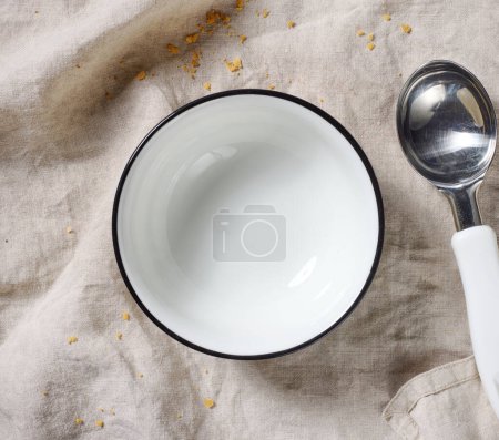 Photo for Empty white ice cream bowl on table, top view - Royalty Free Image