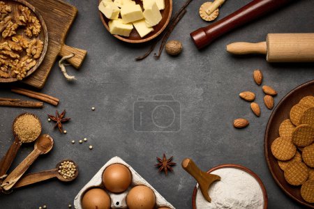 Photo for Various baking ingredients on dark grey background - Royalty Free Image