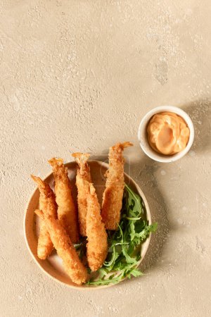 Photo for Plate of breaded Torpedo shrimps, top view - Royalty Free Image