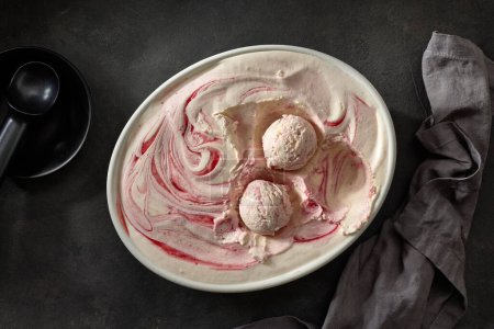 Photo for Homemade strawberry and vanilla ice cream on dark grey kitchen table, top view - Royalty Free Image