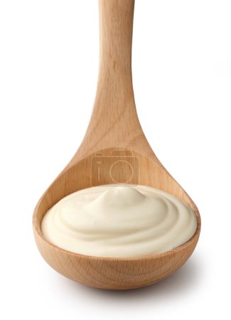 Photo for Sour cream yogurt in wooden ladle isolated on white background - Royalty Free Image