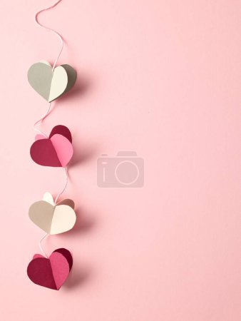 Photo for Heart shaped paper decoration on pink background, top view - Royalty Free Image