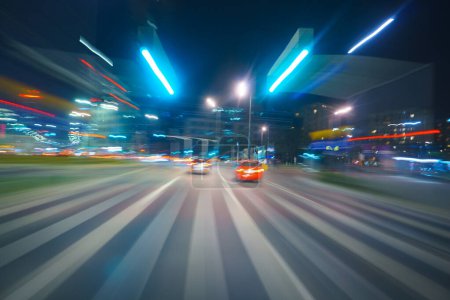 Photo for Driving through the city at night, motion blur - Royalty Free Image