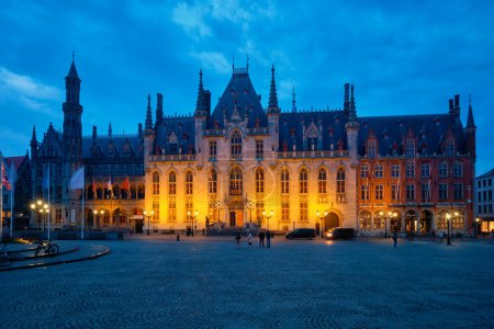 Photo for Bruges, Belgium - May 28, 2018: Famous tourist destination Grote markt square and Provincial Court building in Bruges, Belgium in the night - Royalty Free Image