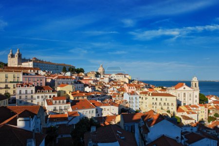 Photo for View of Lisbon. Famous postcard iconic view from Miradouro de Santa Luzia tourist viewpoint over Alfama old city district. Lisbon, Portugal. - Royalty Free Image