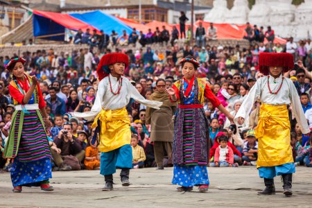 Photo for LEH, INDIA - SEPTEMBER 08, 2012: Young dancers in traditional Ladakhi Tibetan costumes perform folk dance at the Annual Festival of Ladakh Heritage in Leh, India. September 08, 2012 - Royalty Free Image