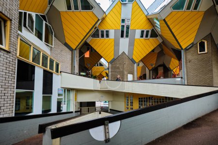Photo for ROTTERDAM, NETHERLANDS - MAY 24, 2018: Cube houses - innovative cube-shaped houses designed by architect Piet Blom with main idea to optimize space, now became a tourist attraction - Royalty Free Image