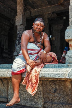 Photo for Kanchipuram, India - September 12, 2009: Unidentified temple brahmin in Ekambareswarar Temple, Kanchipuram. The city is a holy pilgrimage site for Hinduists - Royalty Free Image