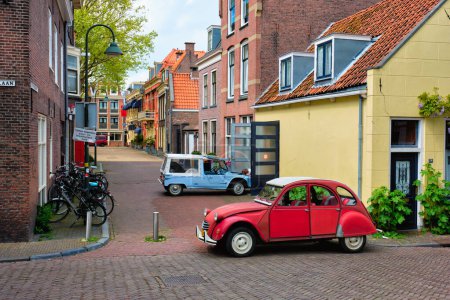 Photo for Delft, Netherlands - May 12, 2017: Retro vintage cars Citroen 2CV and Citroen Mehari in street of Delft - Royalty Free Image