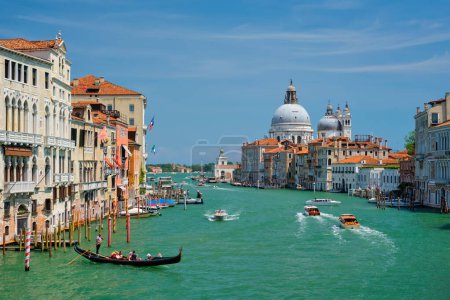 Photo for VENICE, ITALY - JULY 19, 2019: View of Venice Grand Canal with boats and Santa Maria della Salute church in the day from Ponte dellAccademia bridge. Venice, Italy - Royalty Free Image