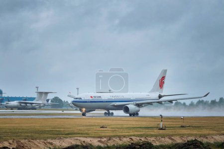 Photo for MINSK, BELARUS - JUNE 15, 2018: Air China flight Airbus A330-200 plane taking off on runway in National Airport Minsk - Royalty Free Image