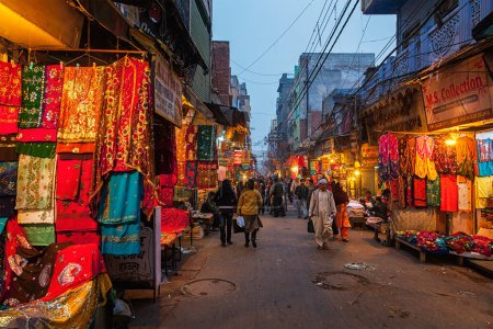Photo for DELHI, INDIA - JANUARY 2, 2010: People in Chitli Qabar Bazar market street of Old Delhi in the evening - Royalty Free Image