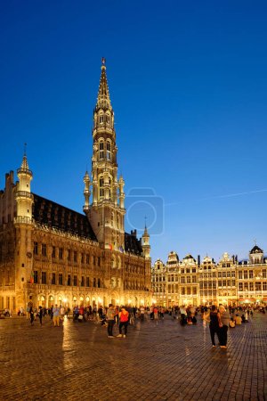 Photo for Brussels, Belgium - May 31, 2018: Grote Markt (Grand Place) square crowded with tourists illuminated at night. Bruxelles, Belgium - Royalty Free Image