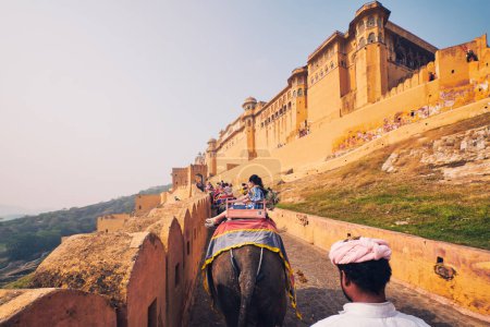 Photo for AMER, INDIA - NOVEMBER 2, 2019: First person FPV point of view POV of tourists riding elephants on ascend to Amer (Amber) fort, Rajasthan, India. Amer fort is famous tourist destination and landmark - Royalty Free Image