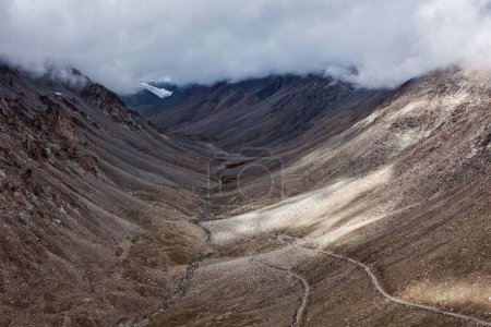 Photo for Himalayan valley landscape with road near Kunzum La pass - allegedly the highest motorable pass in the world (5602 m), Ladakh, India - Royalty Free Image