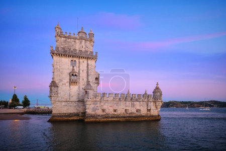 Photo for Belem Tower or Tower of St Vincent - famous tourist landmark of Lisboa and tourism attraction - on the bank of the Tagus River (Tejo) in evening dusk after sunset with dramatic sky. Lisbon, Portugal - Royalty Free Image