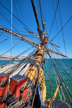 Photo for Bowspirit of old wooden sail ship with a lot of gear cordage rope - Royalty Free Image