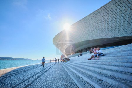 Photo for Lisbon, Portugal - August 08, 2022: MAAT - Museum of Art, Architecture and Technology is a modern building on a bank of Tagus river with sun. Lisbon, Portugal - Royalty Free Image