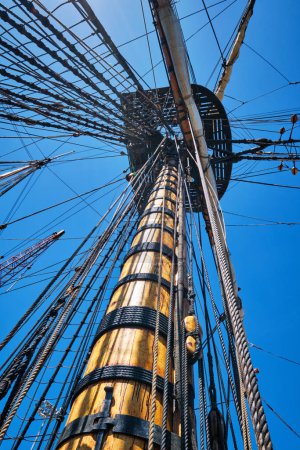 Photo for Masts of old wooden Age of sail sailing ship with ropes cordage and shroud and crows nest - Royalty Free Image