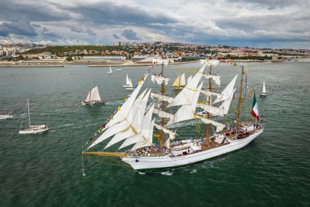 Photo for Aerial drone view of tall ships with sails sailing in Tagus river towards the Atlantic ocean in Lisbon, Portugal - Royalty Free Image
