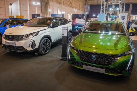 Photo for Lisbon, Portugal - May 12, 2023: Peugeot 3008 and Peugeot 308 hybrid cars on display at ECAR SHOW - Hybrid and Electric Motor Show - Royalty Free Image