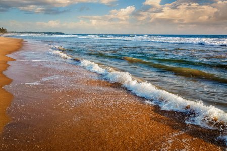 Photo for Wave surging on sand on beach. Hikkaduwa, Sri Lanka - Royalty Free Image