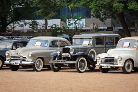 Photo for CHENNAI - INDIA - JULY 24, 2011: Vauxhall Velox 1951, Dodge 1931 and Chevrolet Fleet Master retro vintage cars on Heritage Car Rally 2011 of Madras Heritage Motoring Club at Egmore on July 24, 2011 in Chennai, India - Royalty Free Image