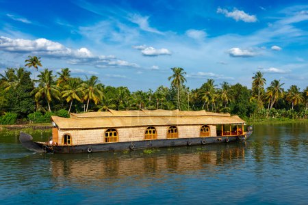 Photo for Kerala India tourism travel background - Houseboat on Kerala backwaters in Kerala state of India - Royalty Free Image