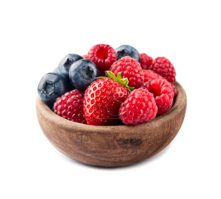 Sweet raspberry, strawberry and blueberry in wooden bowl on white backgrounds.