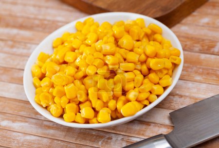 Closeup of appetizing grains boiled corn on plate